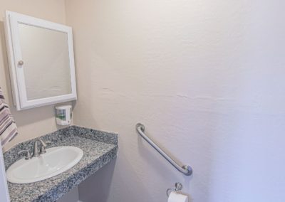 Bathroom wash area with mirror and soap