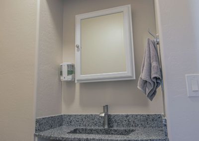 Tidy and lovely wash area with mirror and hand soap