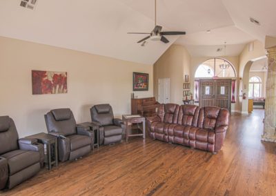 Living room for seniors with six lazy boy chairs